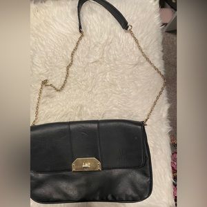 Black shoulder bag with gold chain